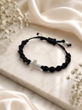 Braided bracelet with silver cross and silver end beads