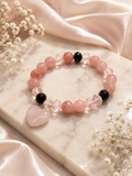 Pink beaded bracelet with subtle pink heart