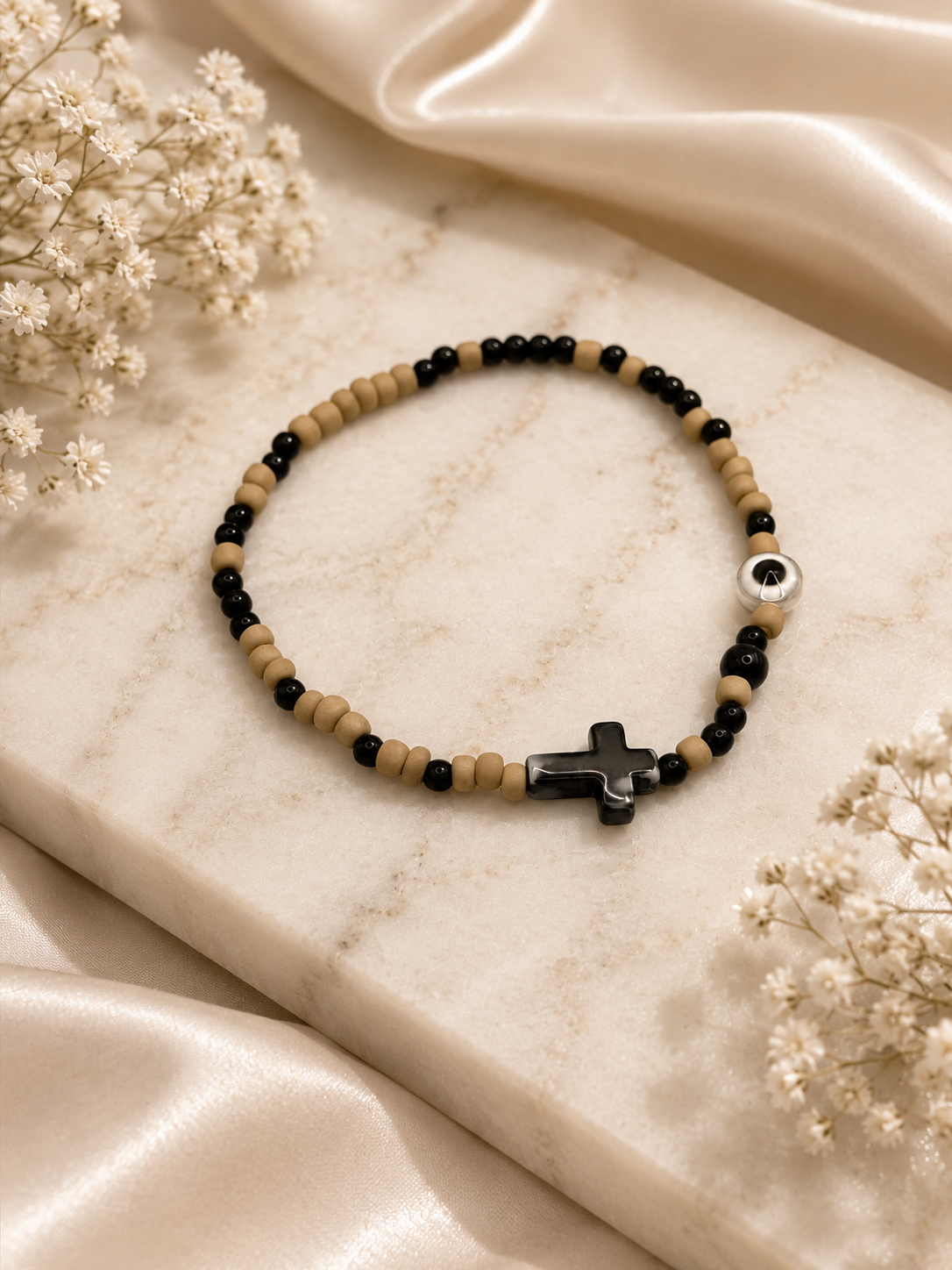 Beaded bracelet with cross and eye